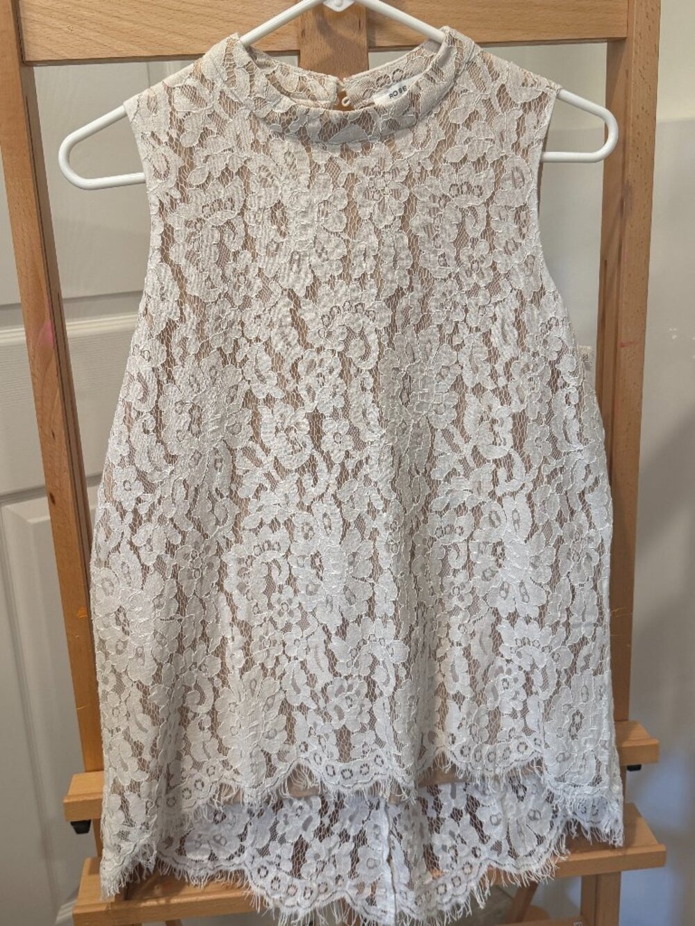 Rose + Olive Size Medium white lace overlay on beige/khaki background mock neck